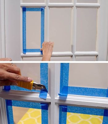 Sectioning off door panes with painters tape.