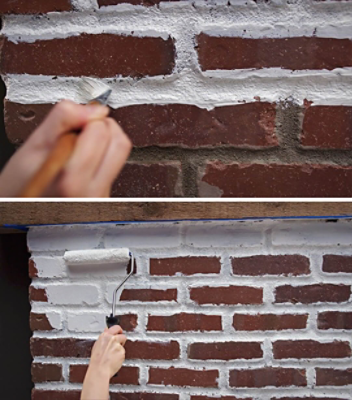 Painting a brick fireplace with white paint.