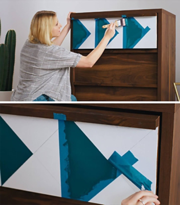 A woman is painting a two toned design on a dresser drawer. S-W colors featured: SW 6496 Oceanside.