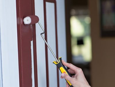 Person rolling a front door. 