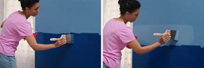A woman painting the edges of a blue ombre wall 