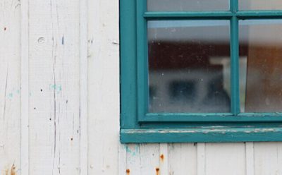 A window sill with peeling paint.