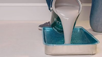 Pouring paint in a tray. SW color featured: SW 9167.