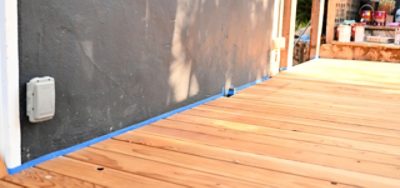 A clean deck outlined with painter's tape prepared for staining