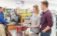 A couple buying paint at the Sherwin-Williams store.