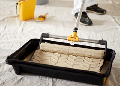 Paint being rolled in a Purdy Tray.