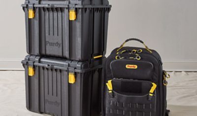 Two black storage boxes and a backpack from Purdy.