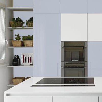 Modern kitchen cabinets without hardware painted a very light purple.