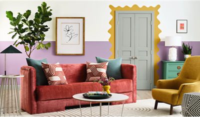 Living room with Radiant Lilac feature wall, Kingdom Gold door frame design, and colorful furniture.