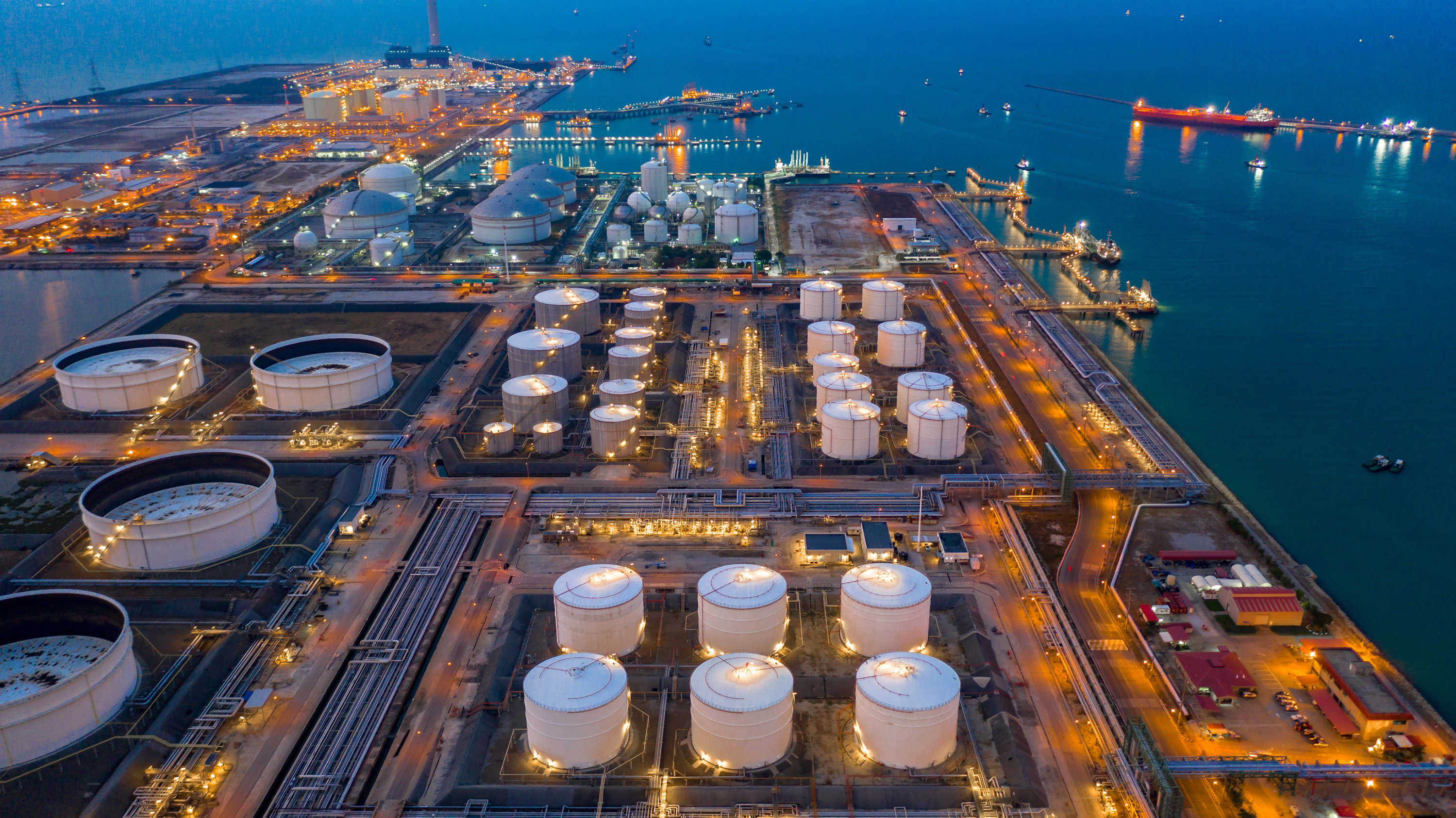 Oil and gas tank refinery at night.