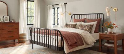 Neutral bedroom with windows.