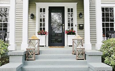 An exterior house photo focusing on the freshly painted brick entry way.