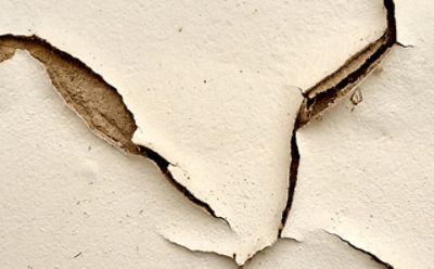 Peeling paint on plaster.