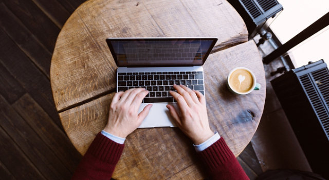 Person typing on computer to download EPS resources and support documents