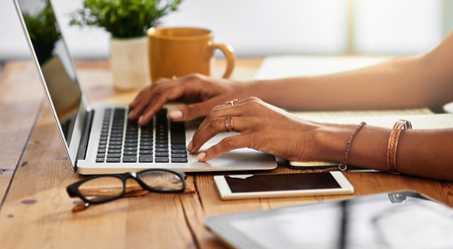 Person typing in computer