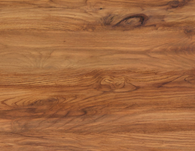 Close-up of a wooden surface featuring a natural grain pattern with varying shades of brown, highlighting the texture, knots, and swirls typical of wood finishes used in interior