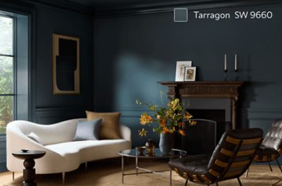 A moody sitting room painted in SW 9660 Tarragon.