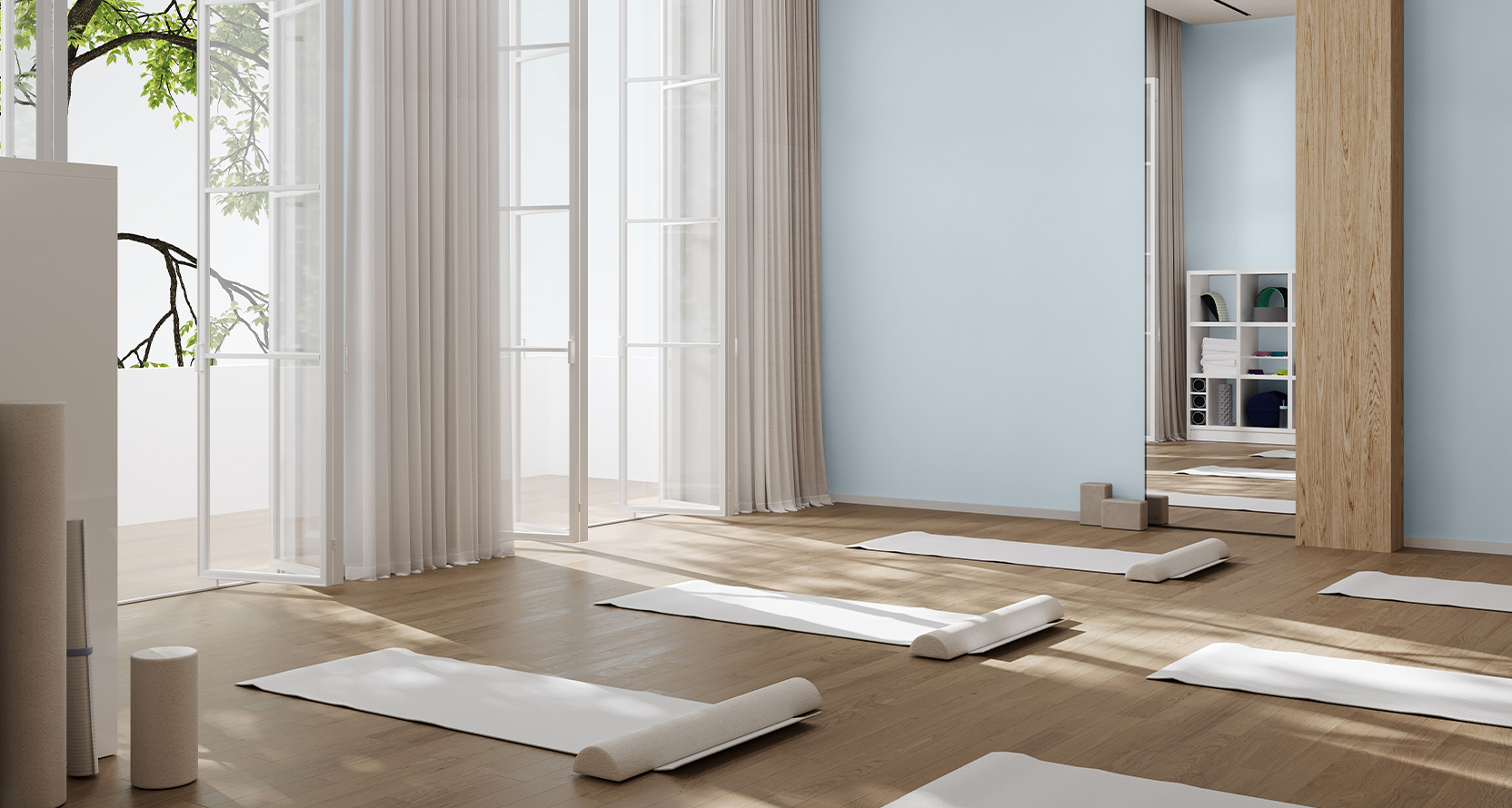 Yoga or meditation space with floor-to-ceiling open windows, Upward painted walls, and meditation mats and bolsters arranged on the natural wood floors.