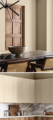 Industrial style dining room with Universal Khaki walls and kitchen area with wooden lower cabinets, marble counters and backsplash, and Universal Khaki uppers. 