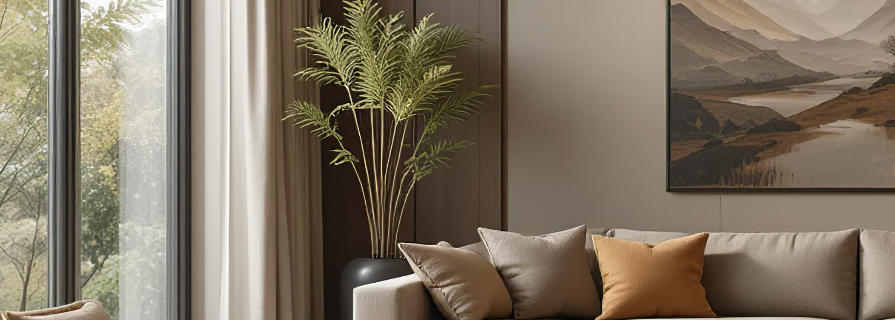 Elegant living room featuring a large sectional sofa, artwork, and natural light, creating a sophisticated and inviting space.