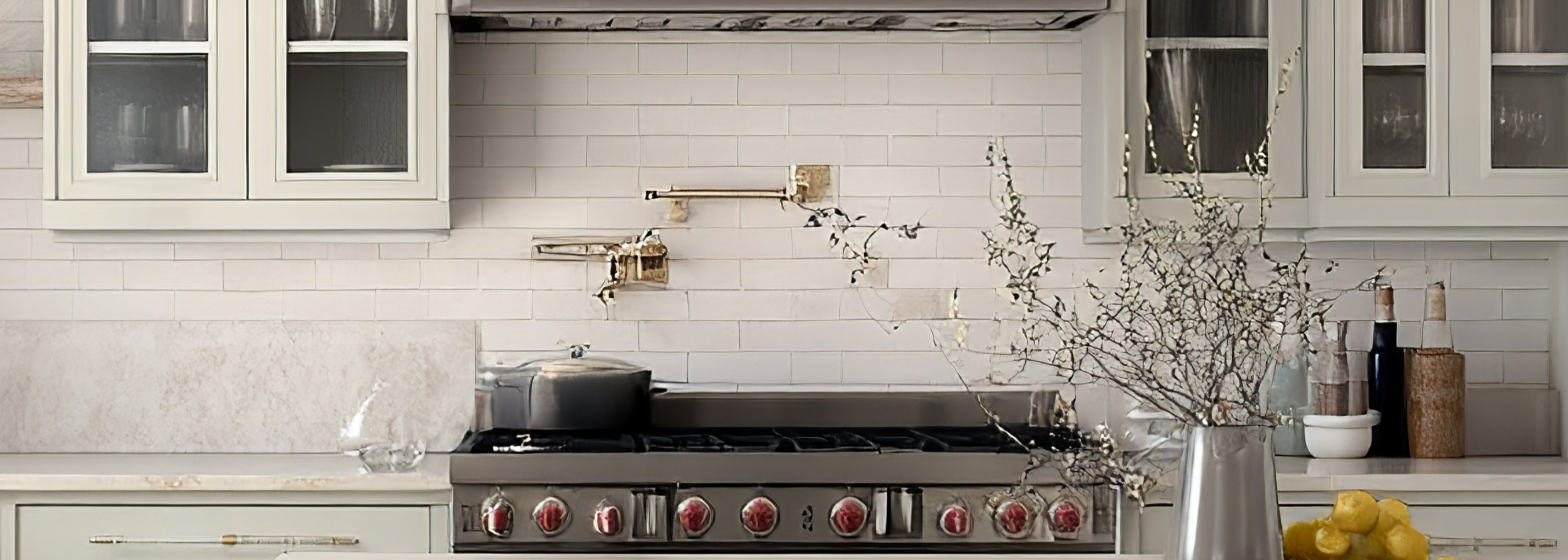 Bright, airy kitchen with island. Natural light illuminates custom cabinets, open shelving, and modern appliances. Warm and inviting interior design.