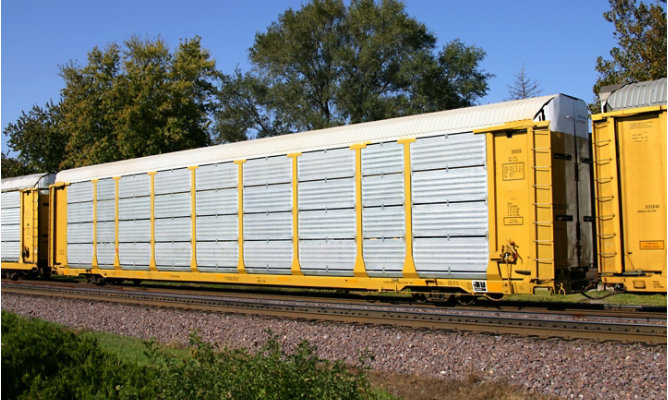 A yellow rail car