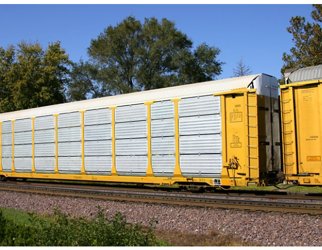 A yellow rail car