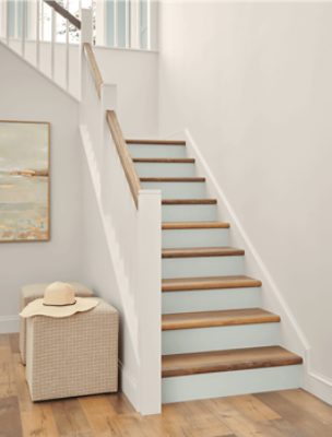 Staircase in a home with white walls.