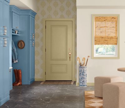 An entryway with built-in shelving painted Smoky Azurite.