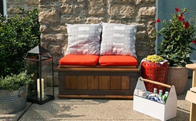 An outdoor stained and painted bench with.