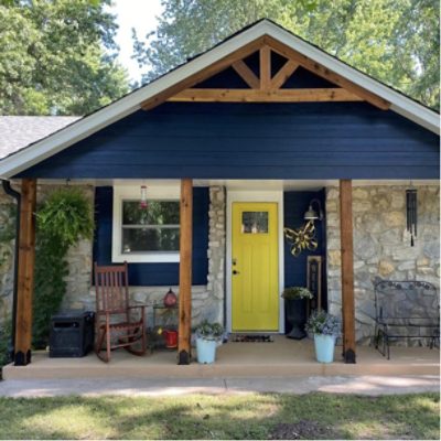 The front exterior of a home with stained wood accents by @andrearn593.