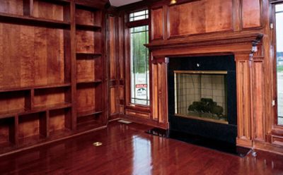 An interior home with wood and hardwood floor paneling. 