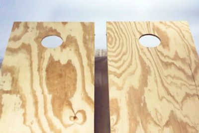 Two unpainted cornhole boards