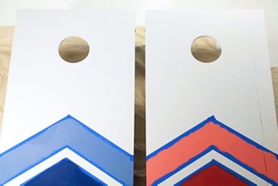 Two freshly painted cornhole boards