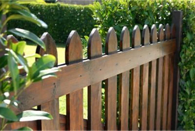 A freshly stained wood fence.