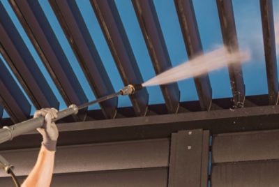 Power washing a pergola.