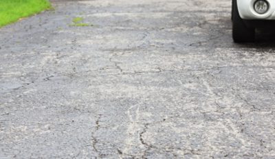 An old driveway with cracks.