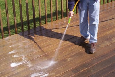 Spraying a deck.