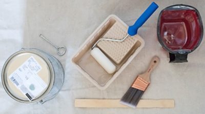 A set of supplies for painting a door.