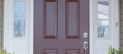 A close up of a brown front door.