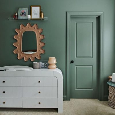 A green bedroom and closet door with a gold mirror. S-W color featured: 6207 Retreat.