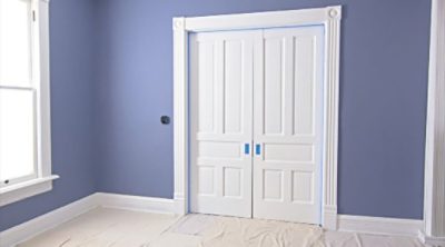 A set of section doors with masking tape trim. SW color featured: SW 6243 Distance.