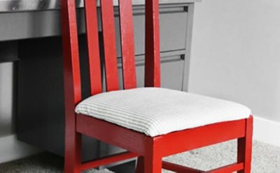 A red painted chair with a gray desk. S-W colors featured: SW 6328 Fireweed, SW 2848 Roycroft.