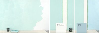 A white wall swatched with various Sherwin Williams paint colors. 