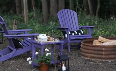 Purple painted Adirondack chairs.