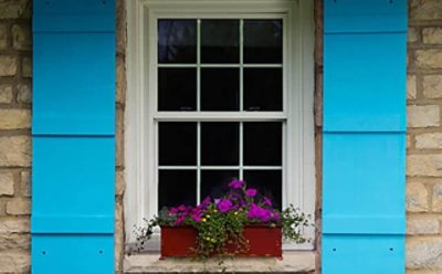 A set of bright blue painted shutters. SW color featured: SW 6787 Fountain.
