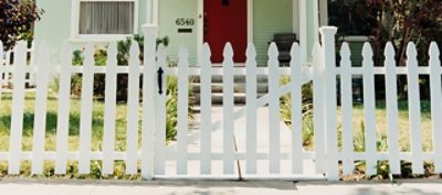 A freshly painted white fence. SW color featured: SW 7006 Extra White.