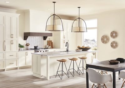 Neutral kitchen with bartop and kitchen table.