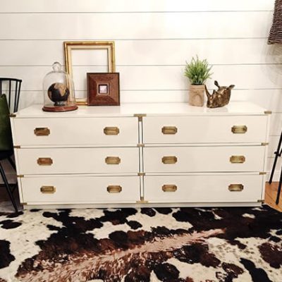A white dresser sitting on top of a white and black patterned rug. S-W colors featured: SW 7042 Shoji White.