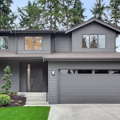 A gray painted exterior home with a garage door. S-W color featured: SW 7048.